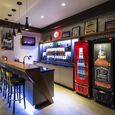 a bar with lots of stools next to it