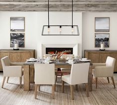 a dining room table with two chairs and a bench in front of the fire place