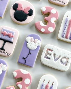 decorated cookies are arranged in the shape of letters and numbers for birthdays, including minnie mouse