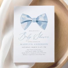 a baby shower with a blue bow tie on it