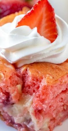 a piece of strawberry cake with whipped cream on top