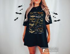 "Step into the enchanting world of darkness and whimsy with our mesmerizing bat collage t-shirt. This unique and captivating design brings together the allure of gothic aesthetics, witchy vibes, and the vintage charm of Halloween. Whether you resonate with dark academia, goblincore, or simply have a love for all things bats, this shirt is a must-have addition to your wardrobe. With its cute and intricately designed bats, it captures the essence of dark cottage core while adding a touch of gothic Fairy Grunge Black Halloween Top, Black Fairy Grunge Tops For Halloween, Fairy Grunge Black T-shirt For Halloween, Dark Academia Goblincore, Cute Bats, Witchy Clothes, Dark Cottage Core, Biology Science, Bat Shirt