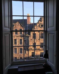 a window with the view of an old building