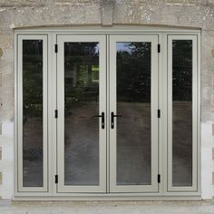 an image of a double doors on the side of a building that is being used as a house