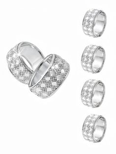 three rings and four smaller ones on a white background, with one ring in the middle