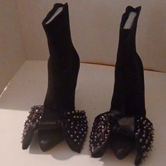 Black Satin Studded Bow Bootie Fitted Black Boots With Metal Feet, Party Boots With Platform And Flat Heel, Fitted Black Spiked Heels, Edgy Flat Heeled Boots For Parties, Spiked Closed Toe Heels For Fall, Fall Spiked Closed Toe Heels, Party Boots With Studs And Flat Heel, Black Studded Heels For Winter, Black Heels With Spikes For Fall