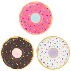 three donuts with sprinkles on them are shown in three different colors