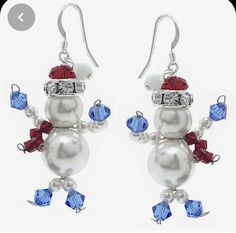 pair of snowman earrings with swarong crystals and red, white and blue beads