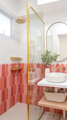 a white sink sitting under a mirror in a bathroom