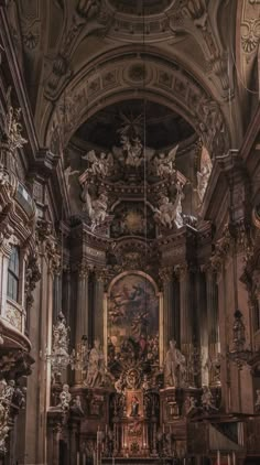 the interior of an old church with many statues