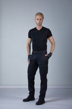 Cyberpunk cargo pants, black techwear pants made in Crease Resist cotton and viscose fabrics. The pants design is a blend of jodhpur and cargo pants. Extra volume on the sides is used for pockets. The pants have 4 pockets. There is one zippered and one open pocket on the front. The same pockets form a very long pocket underneath it that has a less deep pocket inside. The long pockets are 40-45 cm / 15'' 6/8 - 17'' 6/8 deep. Zippered pocket has a molded plastic zippers which have a longer life co Black Techwear Work Pants With Multiple Pockets, Techwear Cargo Trousers, Fitted Outdoor Techwear Pants, Fitted Techwear Pants For Outdoor, Techwear Parachute Pants With Tapered Leg, Fitted Techwear Cargo Pants With Multiple Pockets, Fitted Black Cargo Pants For Outdoor, Techwear Tapered Leg Pants For Outdoor, Fitted Techwear Cargo Pants With Side Pockets