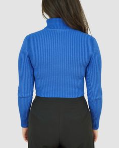 Dive into this deep blue ribbed turtleneck, perfect for a daring long sleeve look! The high-quality fabric will keep you warm and comfortable all day long. Plus, the classic design is perfect for easy mixing and matching with other wardrobe favorites. Model is wearing a small 50% Viscose 30% polyester 20% Nylon Imported Hand wash cold No bleach Lay flat to dry No Iron Blue Turtleneck Top For Fall, Blue High Neck Sweater For Fall, High Stretch Blue Winter Top, Blue Fitted Turtleneck Sweater, Blue Turtleneck Sweater For Layering, Fitted Blue Turtleneck Sweater, Fitted Blue Turtleneck For Winter, Solid Turtleneck With Ribbed Funnel Neckline, Chic Blue Ribbed Sweater