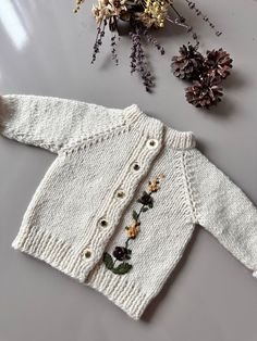 100% organic cotton 🍃 💝🎁 Gift wrapping. A unique gift. The cardigan in the picture is for newborn baby. 👼👼 💦CLEANING AND MAINTENANCE Our products are made of 100% pre-washed muslin fabric. Clothes do not shrink after washing at home. We recommend hand washing with liquid detergent for delicate fabrics using cold water (30 degrees). Wash items inside out. Please take extra care with hand embroidered items. Do not use detergents containing bleach or bleaching agents. Do not use a tumble drye White Hand Knitted Cotton Cardigan, White Hand-knitted Cotton Cardigan, Handmade White Cotton Sweater, Knitted Long Sleeve Sweater As Gift, Knitted Long Sleeve Sweater Gift, Baby Cleaning, Hand Knit Cardigan, Fabric Clothes, Cardigan Design