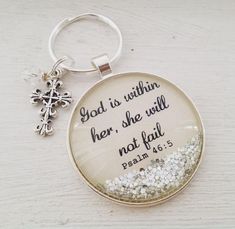 a keychain with a bible verse on it and a snowflake charm