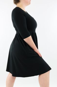 Black Skater Dress features 3/4 length fitted sleeves, invisible pockets, and a v neck-line in a knee length a-line style. NEW SIZING Range: Mini Length DressStyle: 3/4 Sleeve - V-neck - Knee Length Dress Size Recommendation: If in between sizes, size down for a firmer fit, size up for a looser fit. Made with curves in mind Sizes 6-28 Two side pockets V-neckline 3/4 length fitted sleeves Knee length design Skater/A-line style Suitable for curvy body types Relaxed fit vintage style Plain Black Made for comfort A special soft to touch brushed fabric (cottony soft) Polyester/spandex blend (like the casual leggings) Stretches 3-4 sizes with ease Model 1 wears: size S/M - Stats: 12/14 (AUS), Hips 117cm, Waist 93cm, Bust 107cm, Height 164cm. Long Sleeve Black Dresses, Black Dresses Long Sleeve, Black Dresses Long, Warm Winter Dresses, Curvy Body Types, Black Dress With Pockets, Plus Size Black Dresses, Black Skater Dress, Casual Leggings