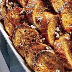 baked french toast with nuts in a white dish