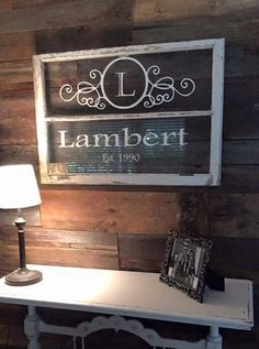 a white table with a lamp on it and a sign that says lamber est 1940