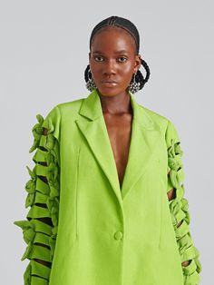 The expert local artisans who make Lisa Folawiyo's designs can take on average up to 240 hours to create a single handcrafted piece—and the attention to detail shows. This blazer has been tailored from smooth silk with peak lapels and smart darting at the front. It's embellished with knotted bows down the sleeves for a modern cut-out finish. Wear it to morning meetings with a crisp shirt and black pants.- Long sleeves, darts, button fastening, single-breasted- Silk- Handcrafted by the in-house t Designer Silk Blazer For Spring, Red Carpet Ready, Fresh Linen, Dress Crafts, Mini Shirt Dress, Floral Maxi, Brim Hat, Green Silk, Bracelets Handmade Beaded