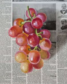 a bunch of grapes sitting on top of a newspaper