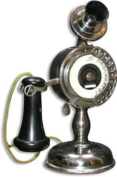 an old fashioned telephone is shown on a white background