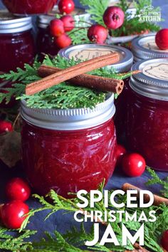 spiced christmas jam in jars with cinnamon sticks and cranberries on the side