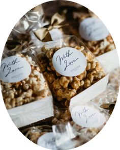 some kind of granola sitting on top of plastic bags with white tags around them