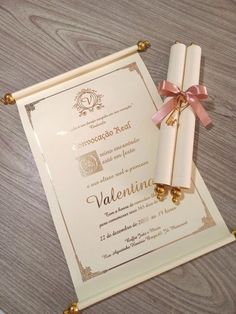 a card with a ribbon tied around it on top of a table