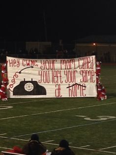 a banner on the sidelines at a football game