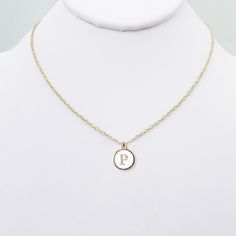 Gold plated P letter white coin necklace for her. Stylish P initial preppy meaningful necklace, a perfect accessory for women who love to showcase their unique sense of fashion. Crafted with a gold-filled chain, this necklace features a beautifully designed typewriter gold-plated letter coin pendant in the shape of the letter P. This charming alphabet necklace doubles as a chic choker, making it an ideal gift for women with an eye for elegance and individuality. Whether it's a birthday celebrati White Round Initial Necklace For Anniversary, Everyday White Initial Pendant Charm Necklaces, White Initial Pendant Charm Necklace For Mother's Day, Minimalist White Initial Necklace For Anniversary, Dainty White Charm Necklaces For Birthday Gift, White Round Charm Necklace For Birthday, Dainty White Charm Necklace For Birthday Gift, White Round Pendant Charm Necklaces For Birthday, White Round Pendant Charm Necklace For Personalized Gift