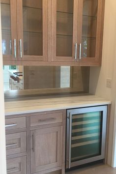 a kitchen with cabinets and drawers in it