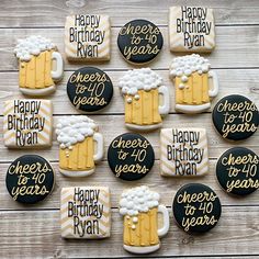 decorated cookies with beer mugs and happy birthday written on them are arranged in rows