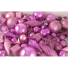 a pile of shiny purple christmas ornaments