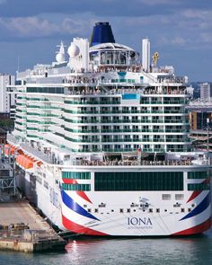 a large cruise ship docked in the water