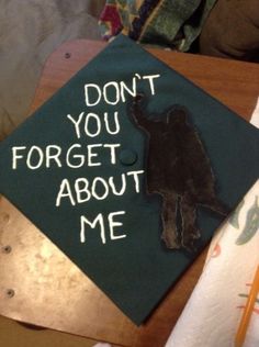 a graduation cap that says, don't you forget about me