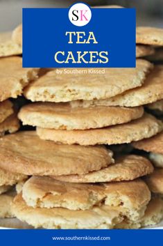 a stack of tea cakes sitting on top of a white plate next to a blue sign