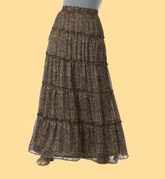 A must have skirt for every boho girl's wardrobe! Our lightweight, cheetah tiered maxi skirt features an elastic waist and tiered hemline. Pair it with sandals and a tee or dress it up with heels for a night out. Runs small- Please go up two size for comfort fitting. 40inch length full lined Hand-wash Beach Tiered Maxi Skirt, Bohemian Tiered Maxi Skirt With Layered Hem, Tiered Maxi Skirt With Elastic Waistband, Flowy Maxi Skirt With Layered Hem, Casual Flowy Tiered Maxi Dress, Casual Maxi Dress With Tiered Gathered Skirt, Casual Maxi Dress With Gathered Tiered Skirt, Vacation Maxi Dress With Ruffled Tiered Skirt, Vacation Tiered Ruffled Maxi Dress