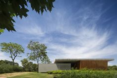 the house is surrounded by trees and shrubs