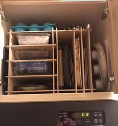 an open dishwasher drawer filled with dishes