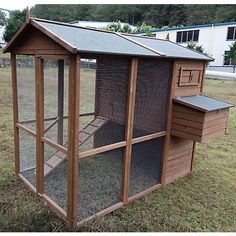 a chicken coop in the middle of a field