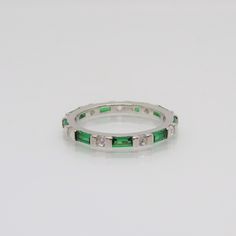 Vintage Sterling Silver Emerald & White Topaz Eternity Band Ring...Marked 925...Total of weights 2.1grams.. Size 8...Measure of Band 2.1MM...It's in very good condition. Silver Emerald-cut Eternity Band, Sterling Silver Emerald-cut Birthstone Ring For Anniversary, Classic Emerald-cut Birthstone Ring In Sterling Silver, Silver-toned Emerald Platinum Ring With Polished Finish, Sterling Silver Hallmarked Emerald Ring, May Birthstone, Eternity Band Ring, 1980s Vintage, White Topaz, Eternity Bands