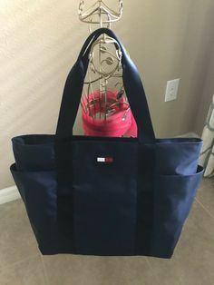 Tommy Hilfiger Tote Handbag Blue Shoulder Bag MSRP $108 NEW - Dual top handles - Top zip closure  - Approx. 20"W x 13.5" x 5"D. - 9.5" L Double Handles. -100% Authentic. Blue Shoulder Bag For Travel With Dust Bag, Casual Blue Shoulder Bag With Dust Bag, Navy Tote Shoulder Bag With Top Carry Handle, Navy Tote Bag With Top Carry Handle, Tommy Hilfiger Rectangular Everyday Shoulder Bag, Everyday Navy Bag With Handles, Everyday Navy Bags, Navy Shoulder Bag With Handles, Tommy Hilfiger Shoulder Bag With Removable Pouch