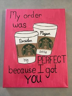 a pink sign with two starbucks cups on it