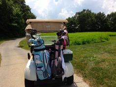 a golf cart filled with bags and equipment