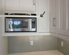 the microwave is built into the wall in the kitchen