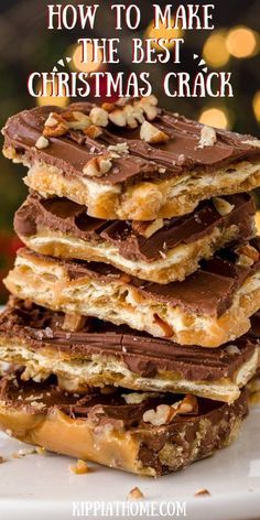 a stack of christmas crackers on top of a white plate with chocolate and nuts