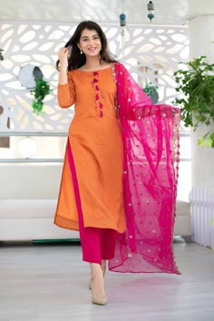 Trendia brings you this Women's Orange And Pink Kurta Set by Label Shaurya Sanadhya. This set includes an Orange Chanderi Kurti that has a boat neck, 3/4th sleeves, and Zari work, a Rayon Slub Pink Pant, and a Pink Organza Dupatta. Kurta:Fabric - ChanderiOrnamentation- Zari WorkColour - OrangeLength - Calf LengthNeck - Boat NeckSleeves- 3/4th Pants:Fabric- Rayon SlubColour- PinkClosure- Elasticated Waistband Dupatta:Fabric- OrganzaColour- Pink Additional info ShippingOur standard time for delive Shaurya Sanadhya, Golden Lehenga, Chanderi Suit, Stitching Designs, Silk Kurti Designs, Pink Kurta, Blue Kurta, Silk Kurti