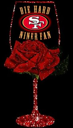 a red rose sitting inside of a wine glass with the san francisco logo on it