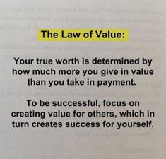 the law of value is written on top of an open book with a yellow marker