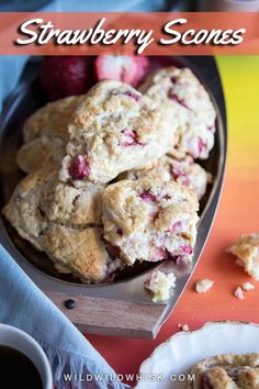 strawberry scones are stacked on top of each other and ready to be eaten by someone