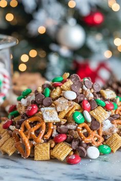 a pile of christmas snack mix sitting on top of a counter